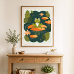 Finished frog on lily pad cross stitch artwork displayed as home decor