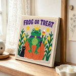 Frog or treat punch needle artwork displayed on a table