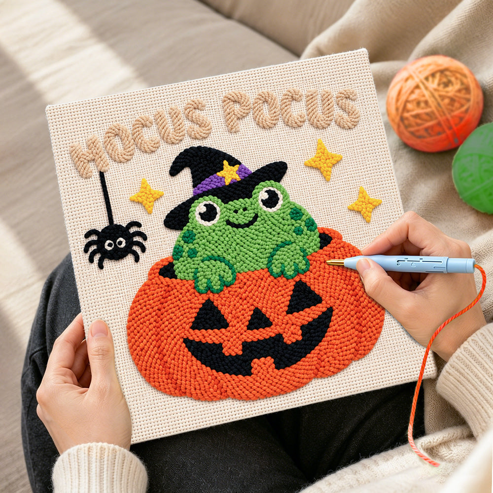 Creating handmade frog witch inside pumpkin punch needle artwork