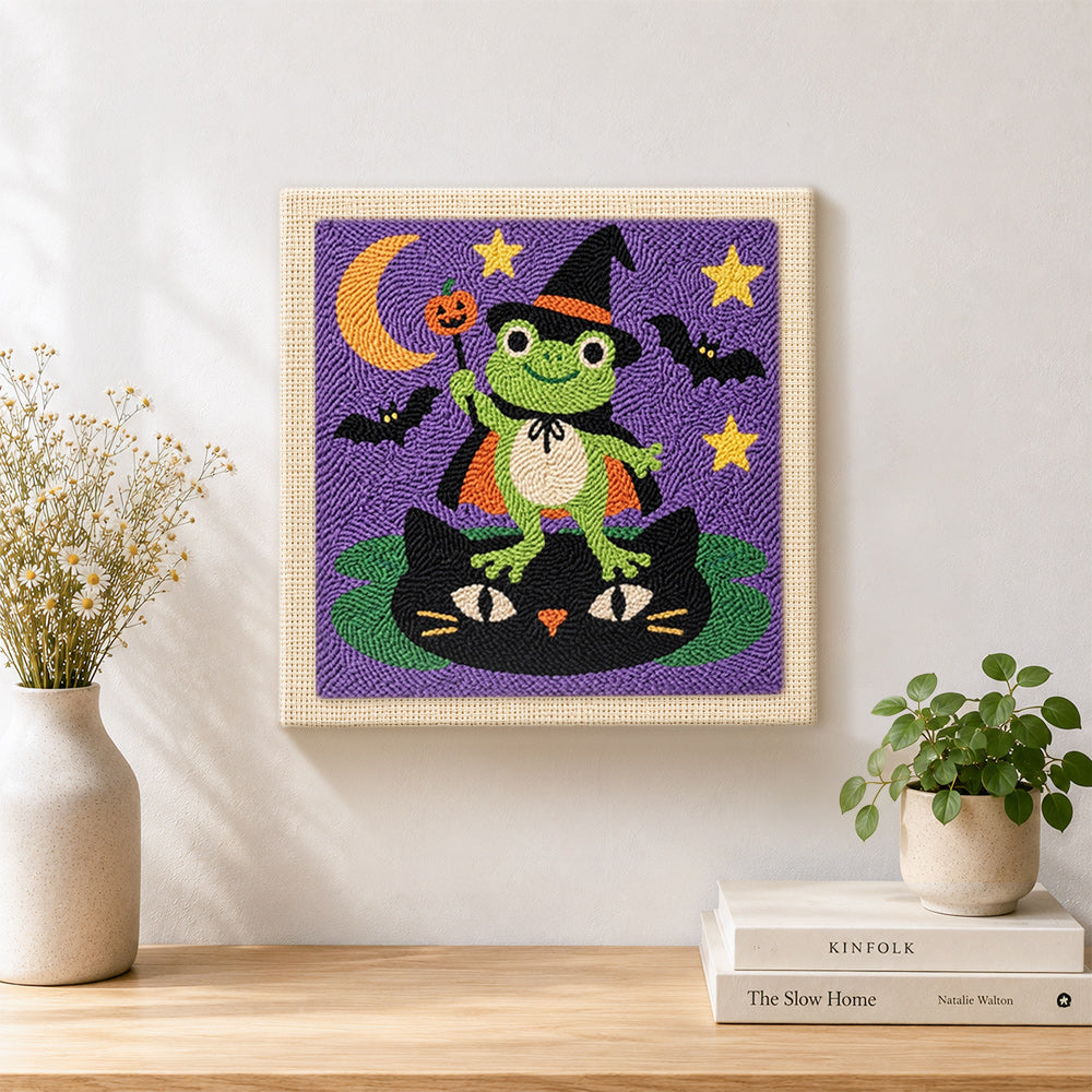 Finished frog wizard standing on cat artwork displayed on a wall