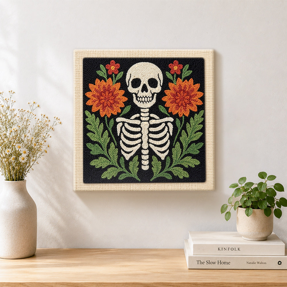 Finished front‑facing floral skeleton artwork displayed on a wall