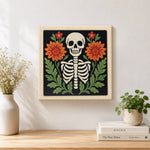 Finished front‑facing floral skeleton artwork displayed on a wall