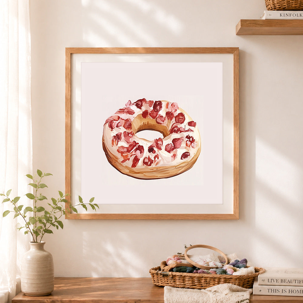 Finished frosted donut cross stitch artwork displayed as home decor