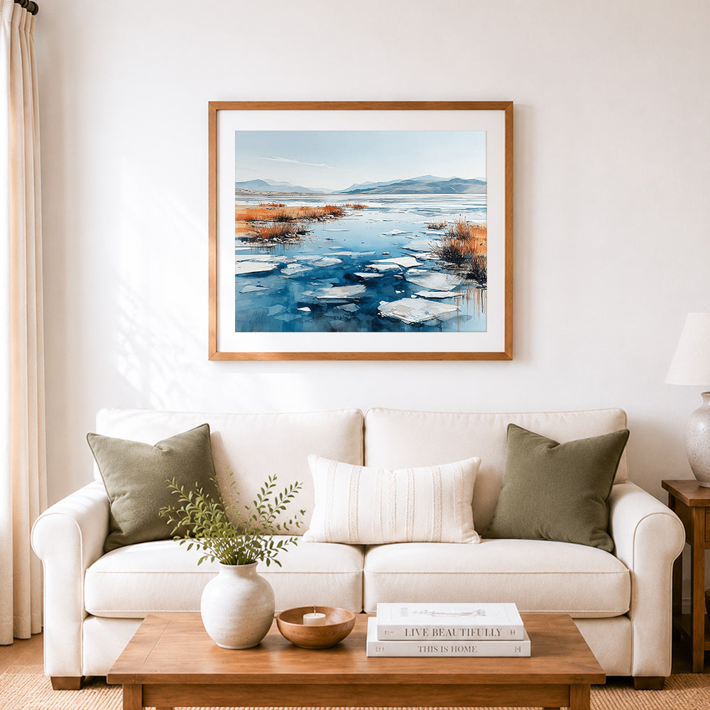 Finished frozen winter lakeshore cross stitch artwork displayed as home decor