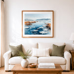 Finished frozen winter lakeshore cross stitch artwork displayed as home decor