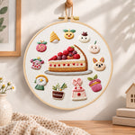 Fruit pie and whimsical motifs embroidery hoop wall art displayed as warm and cozy handmade home decor
