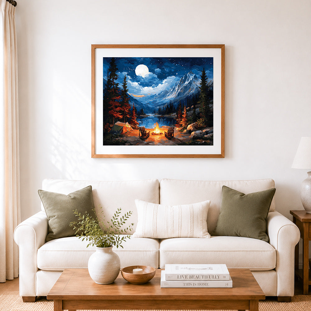 Finished full moon mountain campfire with tent cross stitch artwork displayed as home decor