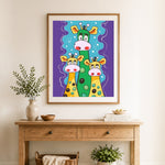 Finished funny giraffe family cross stitch artwork displayed as home decor