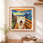 Finished funny screaming cat cross stitch artwork displayed as home decor