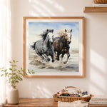 Finished galloping horses on beach cross stitch artwork displayed as home decor