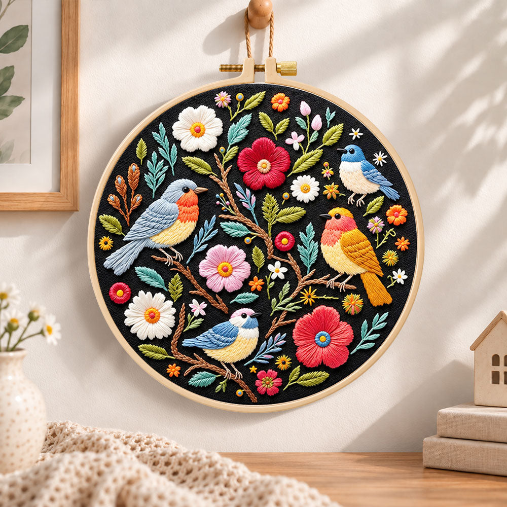 Garden birds and blossoms embroidery hoop wall art displayed as warm and cozy handmade home decor