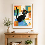 Finished geometric black cat cross stitch artwork displayed as home decor
