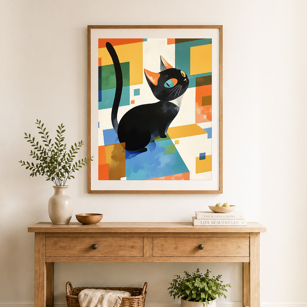 Finished geometric black cat cross stitch artwork displayed as home decor
