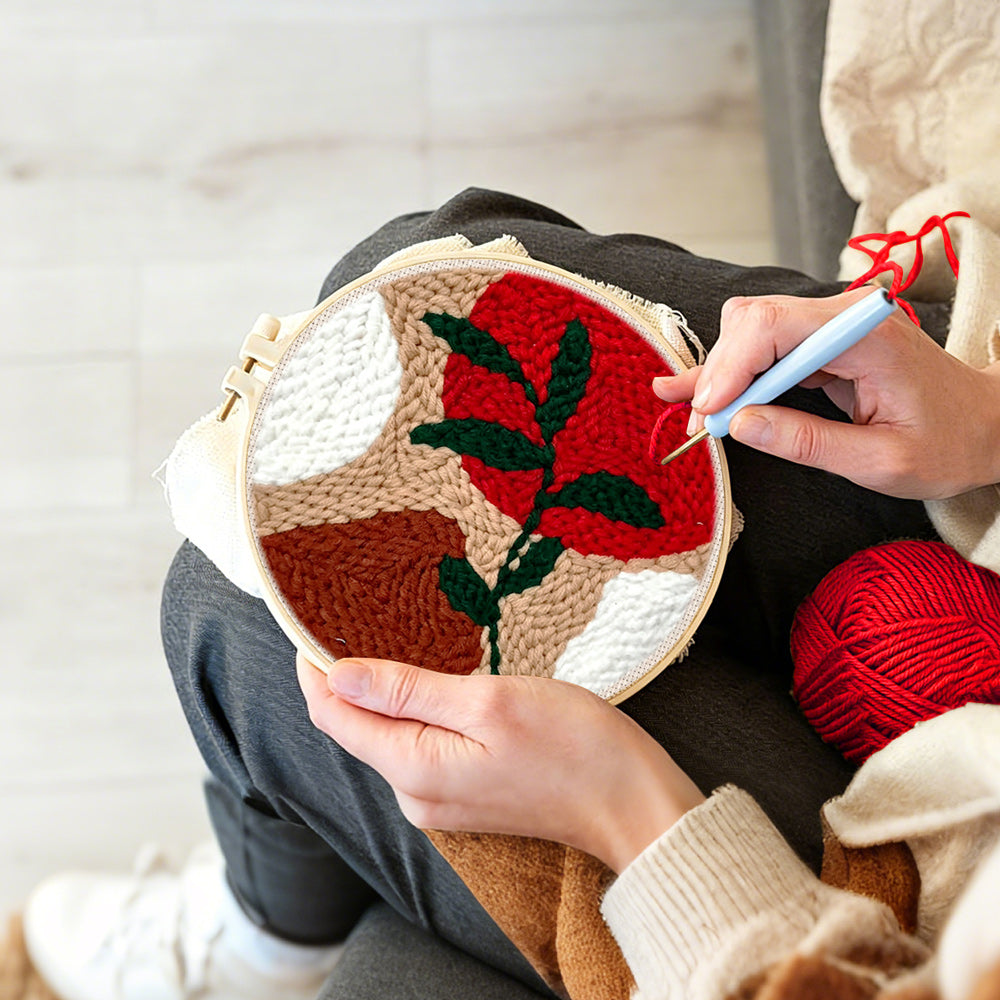 Creating handmade geometric color block with green vine punch needle artwork