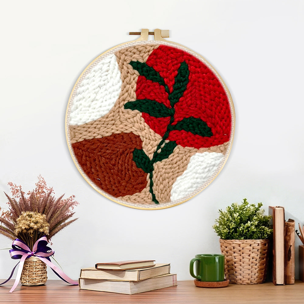 Finished geometric color block with green vine artwork displayed on a wall