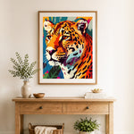 Finished geometric pop‑art leopard cross stitch artwork displayed as home decor