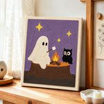 Ghost and owl toasting marshmallows punch needle artwork displayed on a table