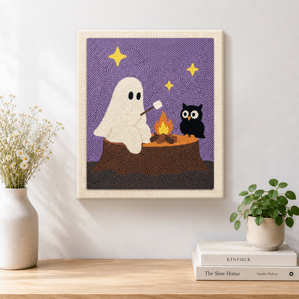 Finished ghost and owl toasting marshmallows artwork displayed on a wall