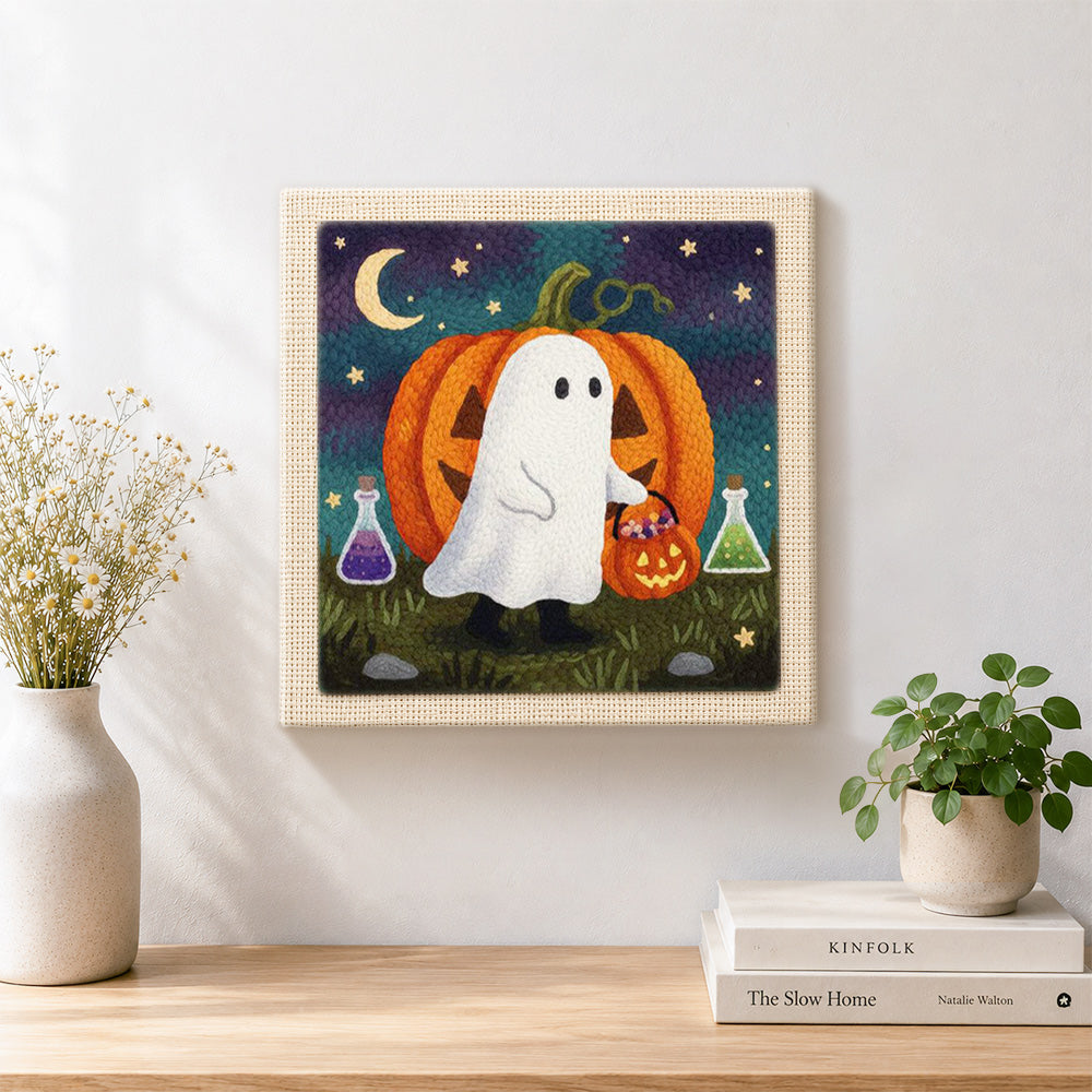 Finished ghost and pumpkin trick or treat artwork displayed on a wall
