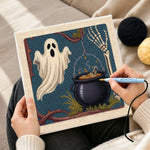 Creating handmade ghost and witch cauldron punch needle artwork