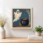 Finished ghost and witch cauldron artwork displayed on a wall