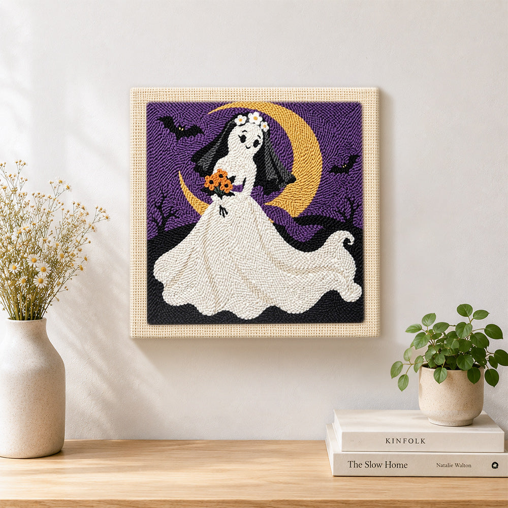 Finished ghost bride with moon artwork displayed on a wall