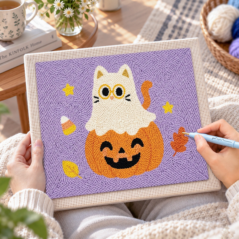 Creating handmade ghost cat on pumpkin punch needle artwork