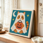 Ghost cat trick-or-treat punch needle artwork displayed on a table