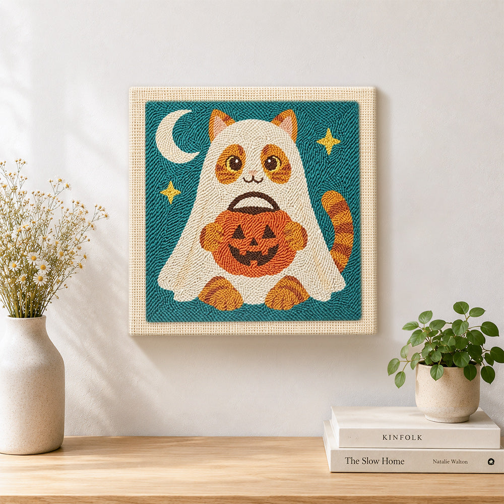 Finished ghost cat trick‑or‑treat artwork displayed on a wall