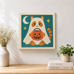 Finished ghost cat trick‑or‑treat artwork displayed on a wall
