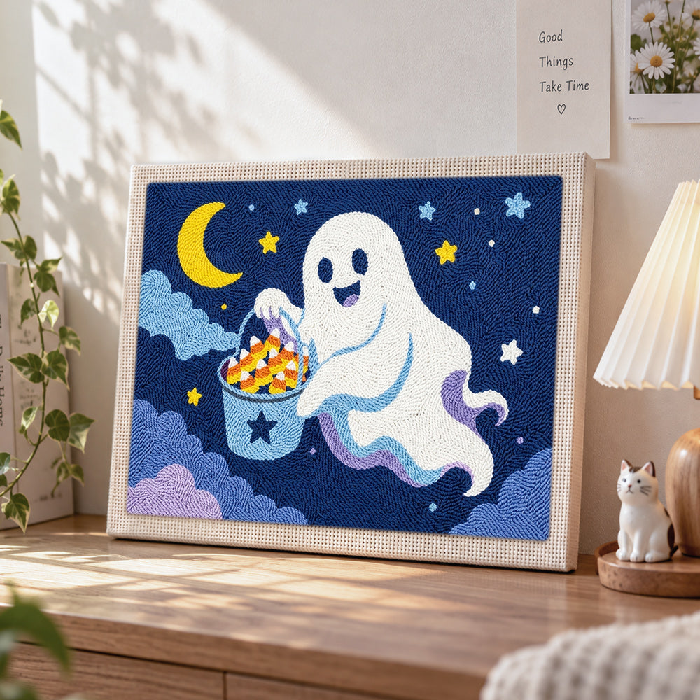Ghost collecting halloween candy punch needle artwork displayed on a table