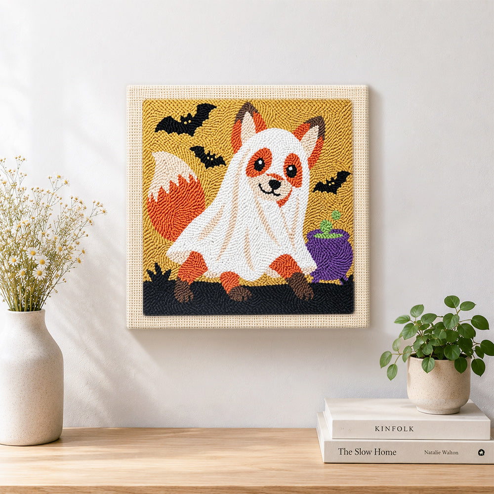 Finished ghost‑costumed fox artwork displayed on a wall
