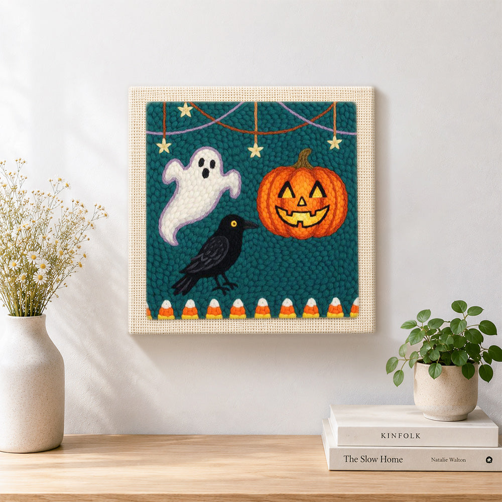 Finished ghost crow and pumpkin harvest artwork displayed on a wall