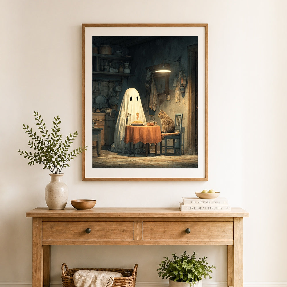Finished ghost eating pasta with cat cross stitch artwork displayed as home decor