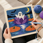Creating handmade ghost floating on water lily punch needle artwork