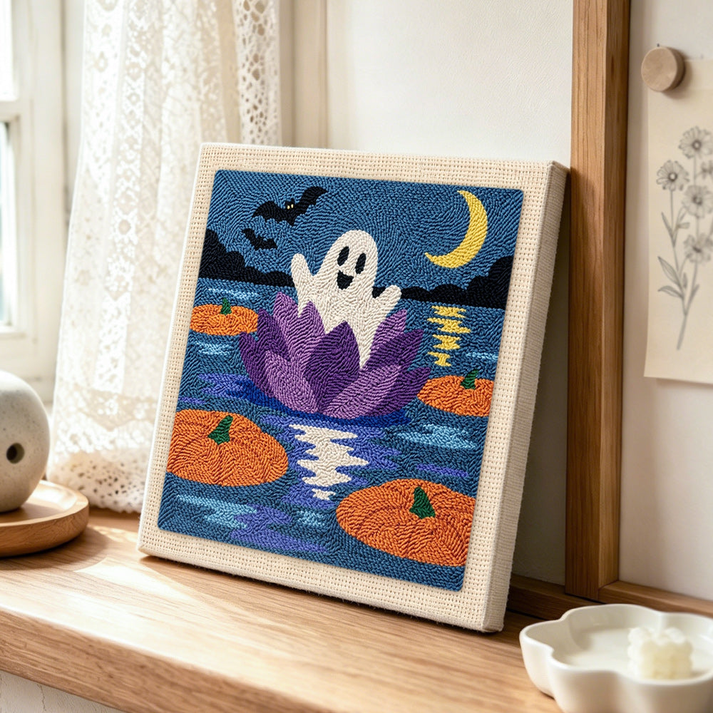 Ghost floating on water lily punch needle artwork displayed on a table