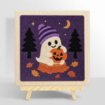 Ghost holding pumpkin punch needle kit for beginners