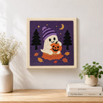 Finished ghost holding pumpkin artwork displayed on a wall
