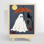 Ghost holding umbrella at graveyard punch needle kit for beginners