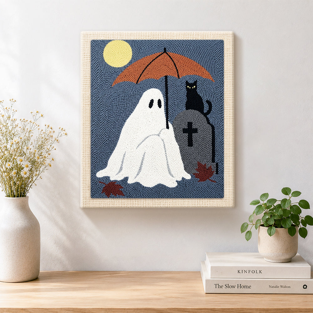 Finished ghost holding umbrella at graveyard artwork displayed on a wall