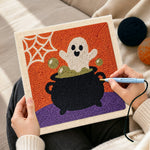 Creating handmade ghost in cauldron punch needle artwork