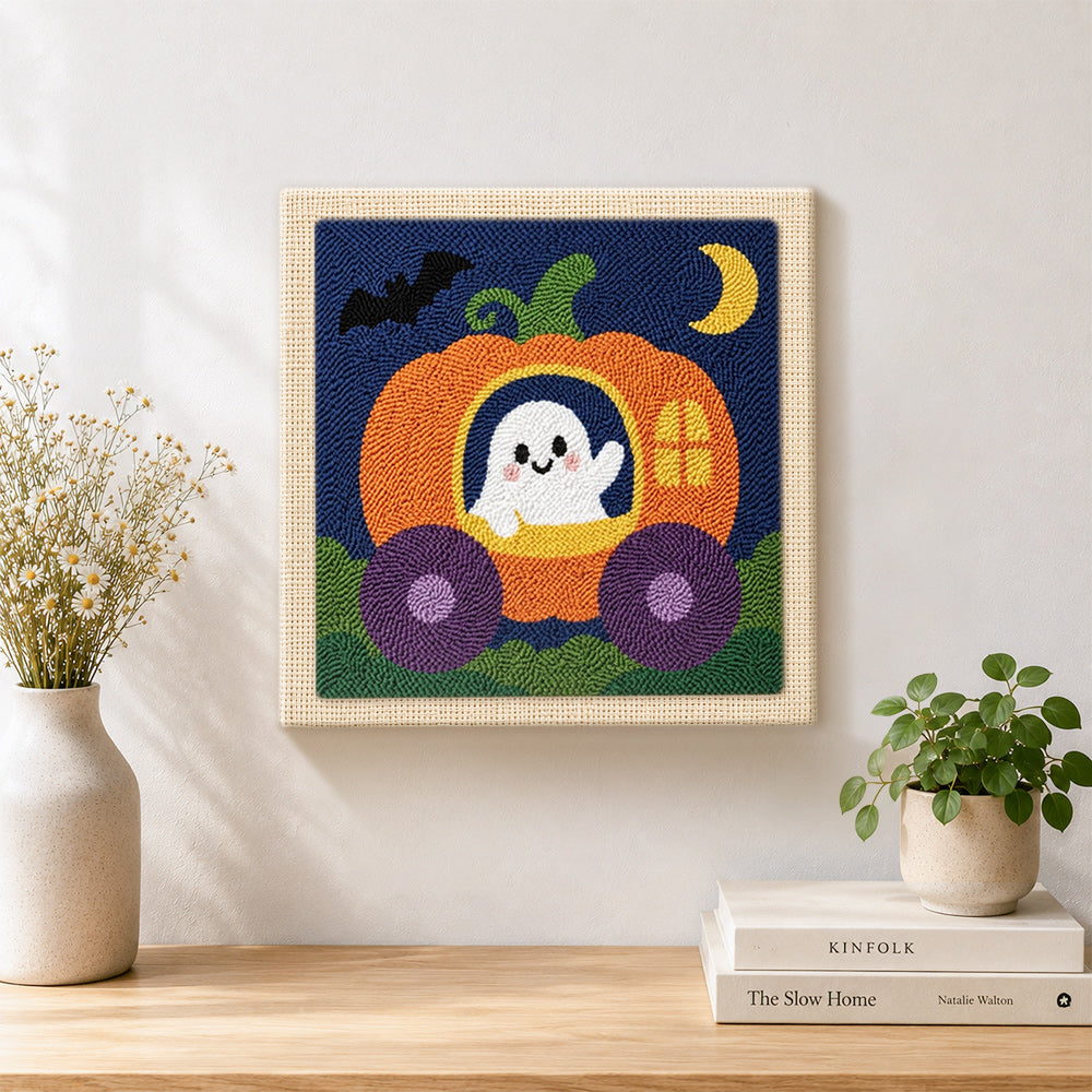 Finished ghost in pumpkin carriage artwork displayed on a wall