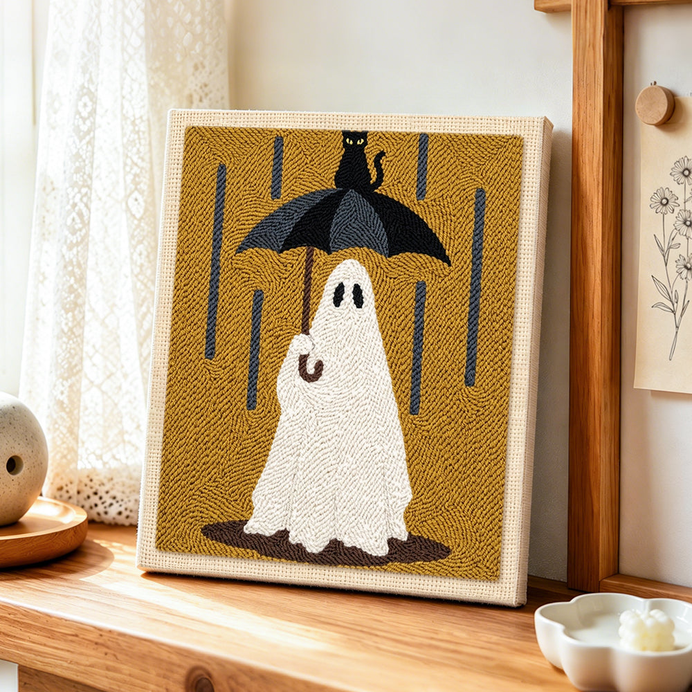 Ghost in rain punch needle artwork displayed on a table