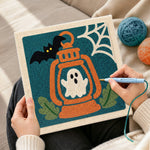 Creating handmade ghost inside lantern punch needle artwork