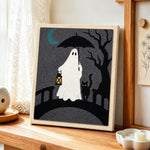 Ghost on bridge punch needle artwork displayed on a table