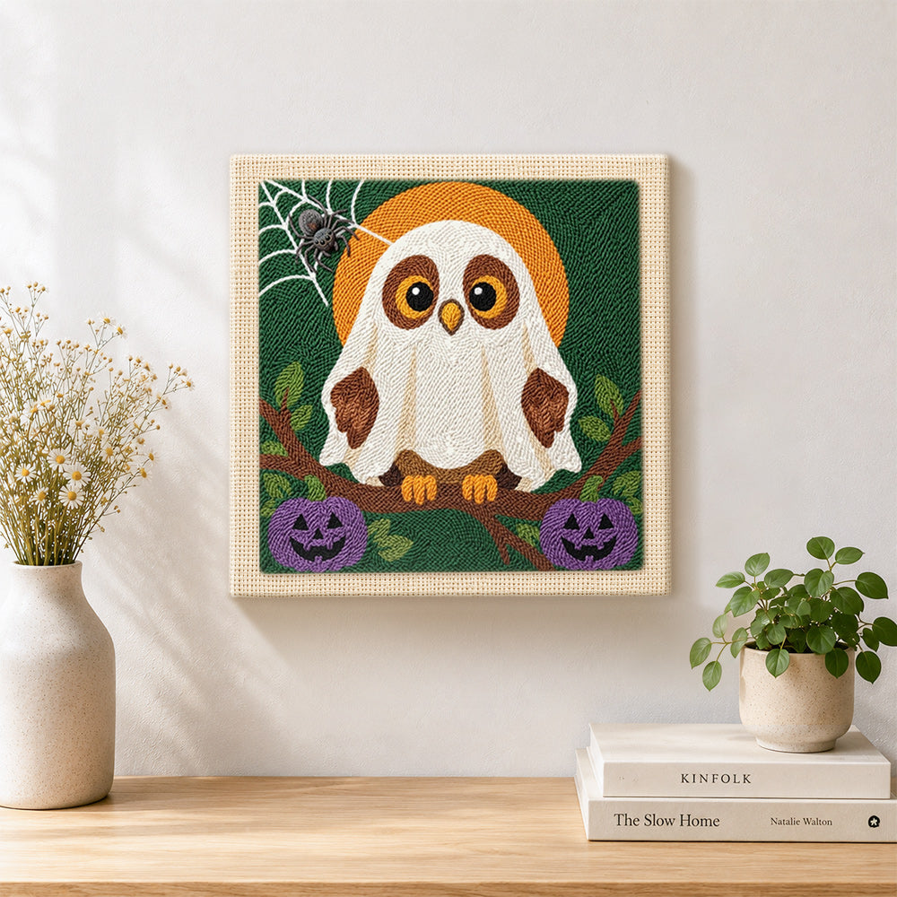 Finished ghost‑owl with pumpkins artwork displayed on a wall