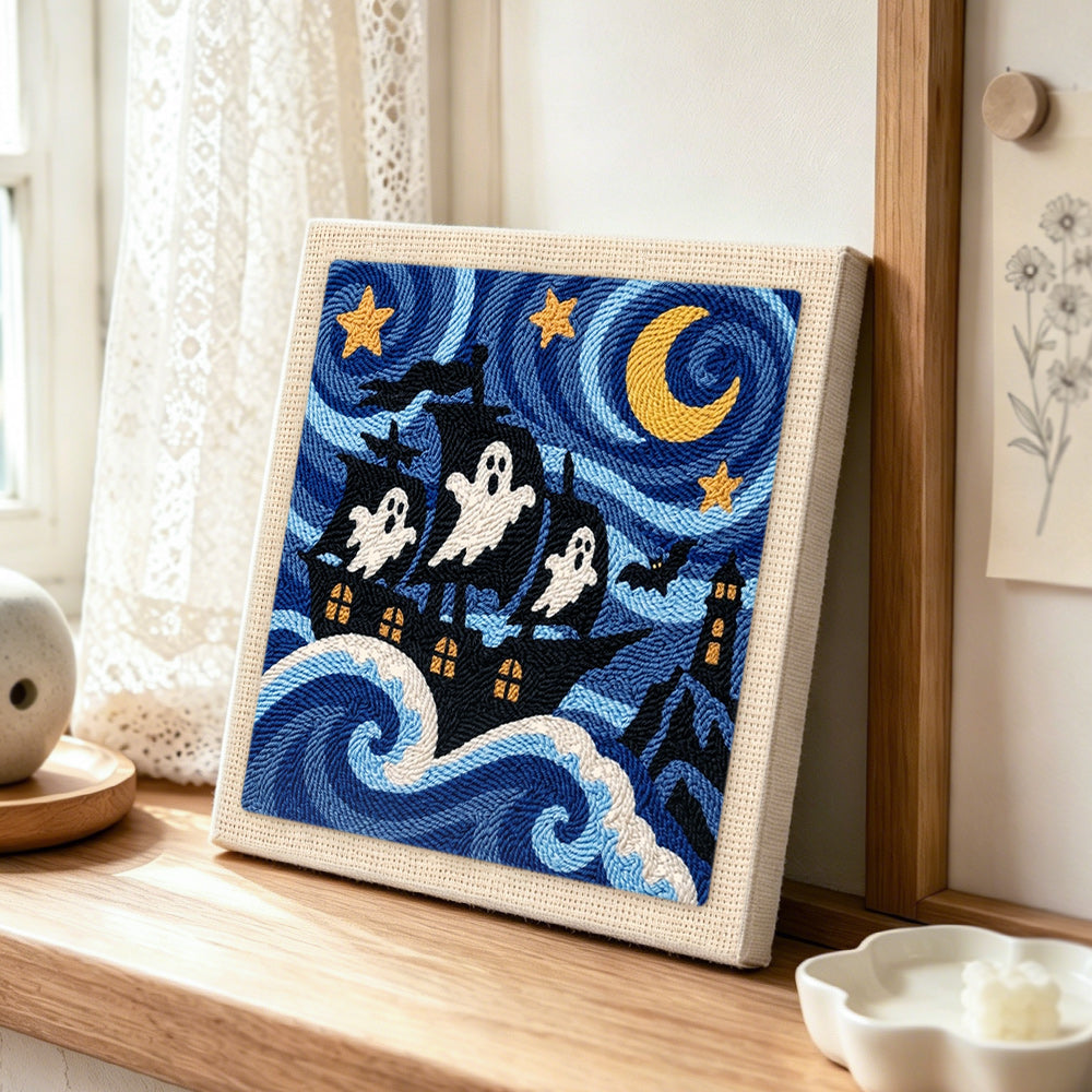 Ghost pirate ship punch needle artwork displayed on a table