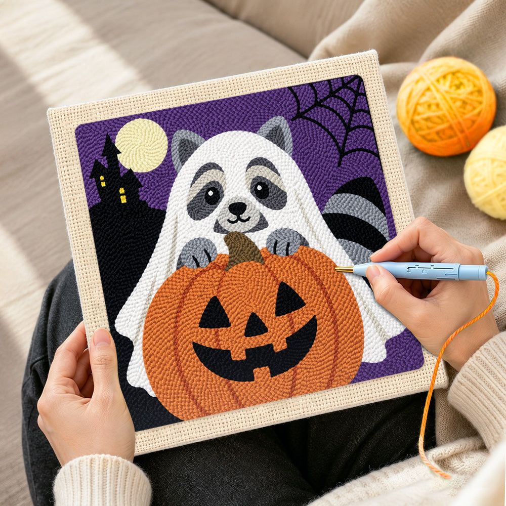 Creating handmade ghost raccoon and pumpkin punch needle artwork