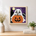 Finished ghost raccoon and pumpkin artwork displayed on a wall
