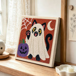 Ghost siamese cat punch needle artwork displayed on a table